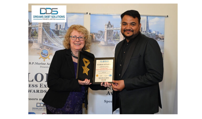 Mr. Rakesh Singh receiving the GBE award from Ms. Terry Marsh